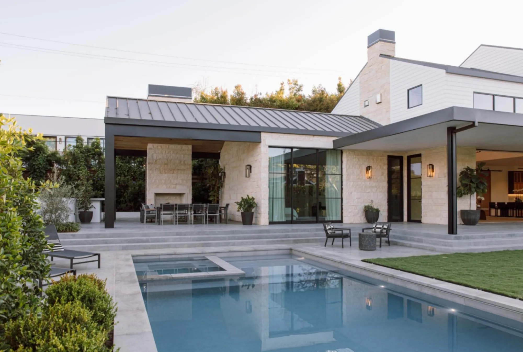 Lombard Estate exterior limestone patio and pool in Pacific Palisades, fabricated and installed by CAD Stone Works